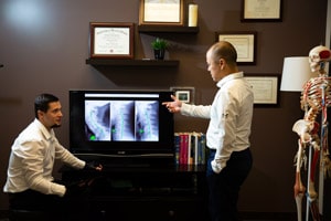 Vancouver WA chiropractors examining x rays