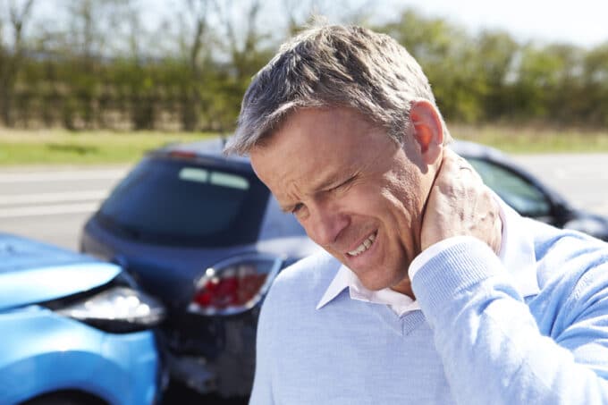 Man holding his neck after a car accident